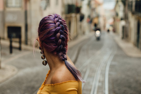 Purple Haired Woman Looking At The Street Of Lisbon, Portugal