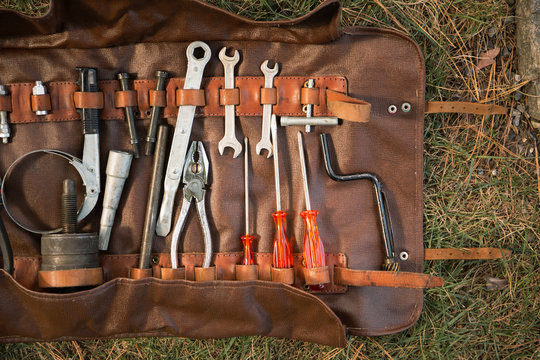Retro Ferrari tool belt in grass