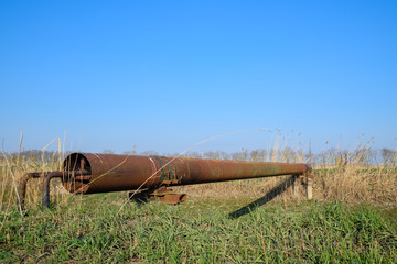 Gas pipeline through irrigation canal in a protective steel pipe.