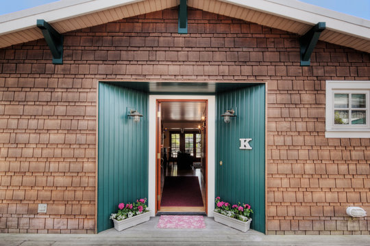 Open front door of wooden house
