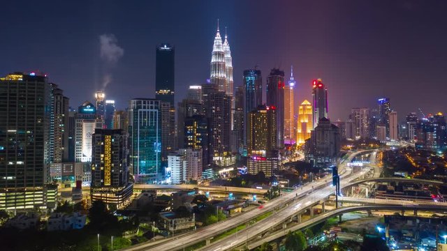 night illumination kuala lumpur cityscape downtown traffic road jam aerial panorama 4k timelapse malaysia