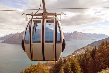 Gondola lift above mountains and lake