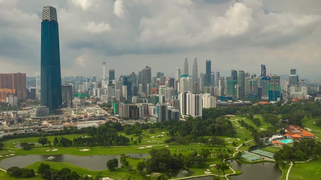 day time kuala lumpur city center golf course aerial panorama 4k timelapse malaysia