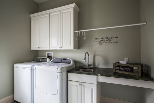 Washing machine, dryer and sink in laundry room