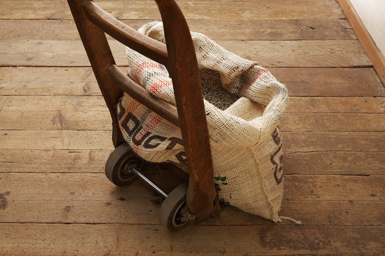 Sack of coffee beans on dolly