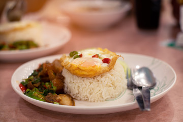 Crispy pork spicy with fried egg