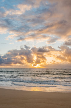 Sunrise over ocean on beach