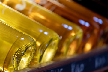 Bottles of wine and rose wine sitting on shelves in a winery in the Wine Route, Stellenbosch, South Africa