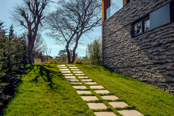 Istanbul, Turkey, 22 March 2015: Beautiful exterior of newly built luxury home. Yard with green grass.