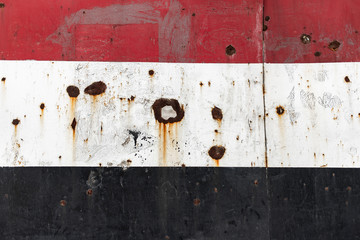 Syrian flag painting with bullet impact