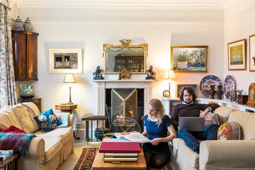 Caucasian couple hanging out in livingroom