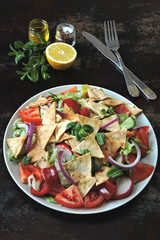 Healthy bright salad with pita bread and vegetables. Fattush Salad. Middle Eastern style.