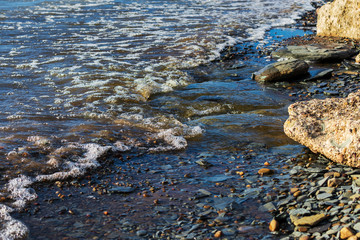 Waves washing of an ungroomed beach