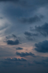 Dramatic cloudscape during a dark and colorful sunset.