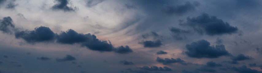 Fototapeta na wymiar Dramatic cloudscape during a dark and colorful sunset.