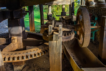 Interior of an old wooden mill. Large wooden gears. 
