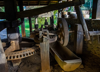 Interior of an old wooden mill. Large wooden gears. 