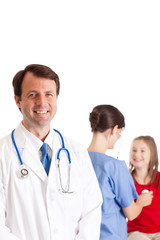 Doctor and Nurse Examining a Little Girl - Medical Healthcare