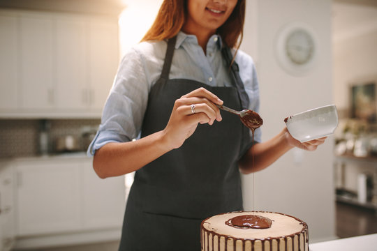 Chef preparing tasty chocolate cake