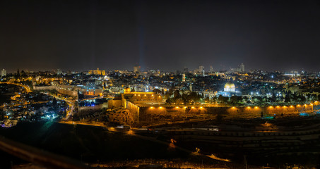 Beautiful aerial panoramic view of the Old City, Dome of the Rock and Tomb of the Prophets during night time. Taken in Jerusalem, Capital of Israel.
