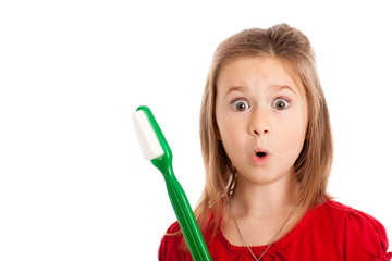 Shocked Girl Holding Large Toothbrush