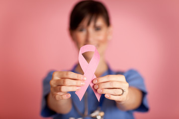Happy Nurse Holding Breast Cancer Awareness Ribbon