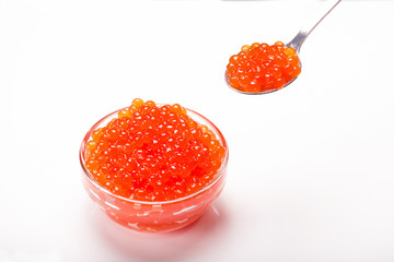 red caviar in glass bowl with spoon isolated on white background