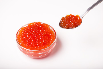 red caviar in glass bowl with spoon isolated on white background