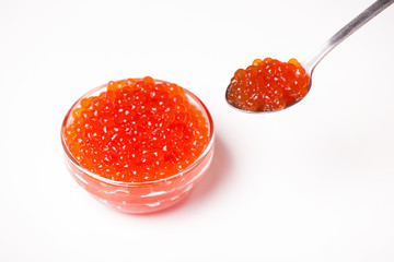 red caviar in glass bowl with spoon isolated on white background