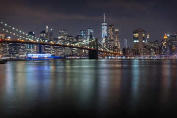 Fototapeta na wymiar New York Bridge at Night Across River