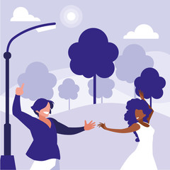 young interracial couple dancing in the park