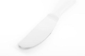 Knife with bokeh in high key with bright setting on white table