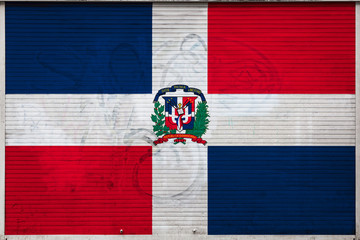 Close-up of old metal wall with national flag of Dominicana. Concept of   Dominicana export-import,...