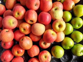 Top view of red apple and green apple as a background for sale in the market at Thailand 