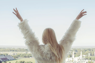 Young Woman back extending her arms