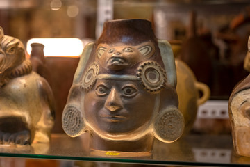 Peruvian replicas of Huacos, traditional ceramics and sculptures from Inca culture for sale at street Indian market in Miraflores, Lima.