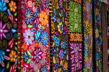 Colorful Peruvian artisanal textiles cloth with inca and traditional patterns for sale at street Indian market in Miraflores, Lima.