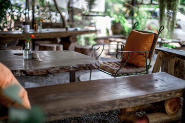 Blurred background of interior room (bakery coffee restaurant) by bringing a vase, wooden table Bookshelves, for the beauty of the shop and impressing those found