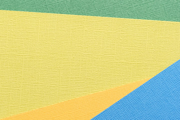 Blue, green, yellow abstract paper background. Paper texture close up