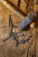 Hammer and nails on wood