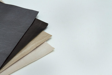 Leather sheet stack of gray color shades on white background