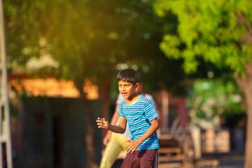 Rural Indian Child Playing Cricket