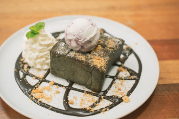 Close up Chocolate Honey Toast In Plate with whip cream and ice cream on topping