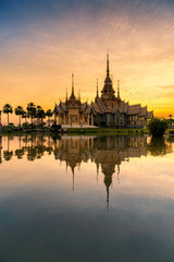 A beautiful sunset view of temple in reflection in twilight  , Nakorn ratchasrima , Thailand