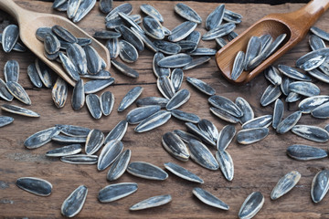 Sunflower seed, snack, in wooden bowl on wood table