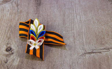 St. George ribbon victory symbol on wooden background