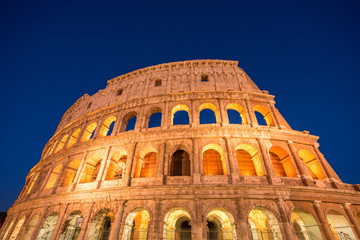 Fototapeta na wymiar Night view of Colosseum in Rome, Italy. Rome architecture and landmark. Rome Colosseum is one of the main attractions of Rome and Italy