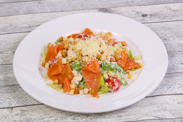 Caesar salad with salmon and parmesan