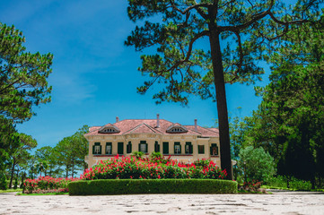 Obraz premium LAM DONG, VIETNAM - APRIL 17: Da Lat King Palace On April 17,2019 in Lam Dong, Vietnam. The old palace that opened for tourists to visit.