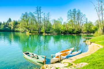 Croatian nature, beautiful Mreznica river panoramic view in spring, popular tourist destination, kayaks on shore